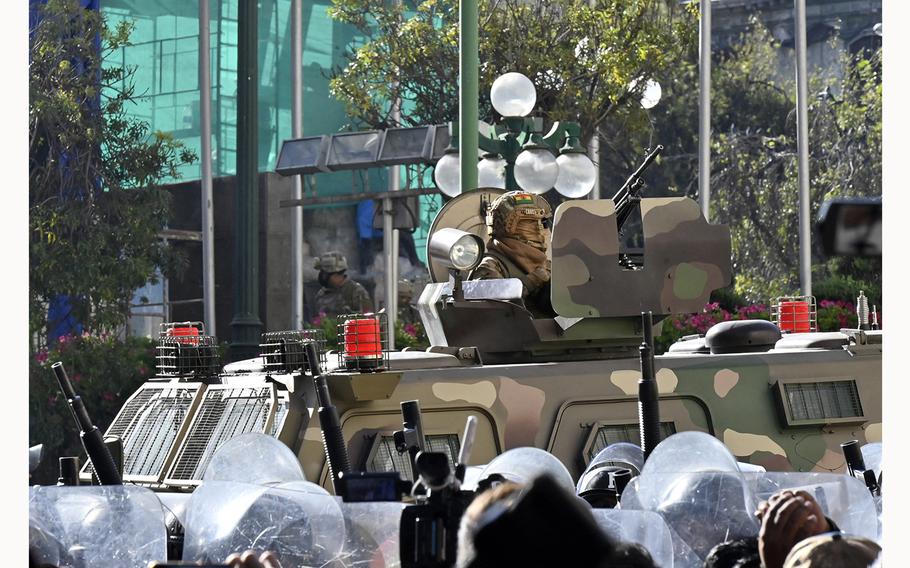 A soldier in an armored vehicle is deployed outside the Quemado Palace at Plaza Murillo in La Paz on June 26, 2024. 