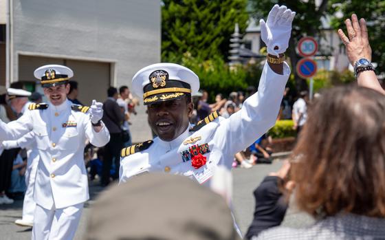 Cmdr. Ronald Jenkins Jr., skipper of the guided-missile destroyer USS Higgins, and Lt. Michael Sparrow, navigator, parade through Shimoda, Japan, during the Black Ship Festival on May 18, 2024.