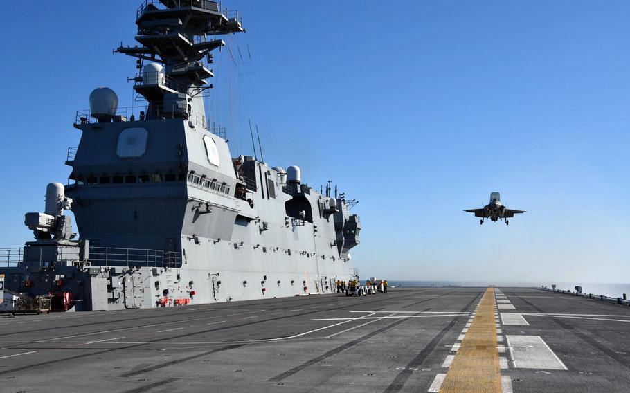 An F-35B Lightning II lands on a Japanese helicopter carrier off California.