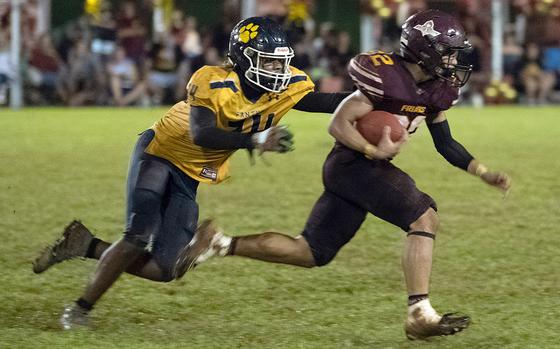 Players such as Justin Brantley, left, and Guam High have found it tough to catch Father Duenas Memorial, winners of 72 straight games dating back 10 years and eight straight island titles.