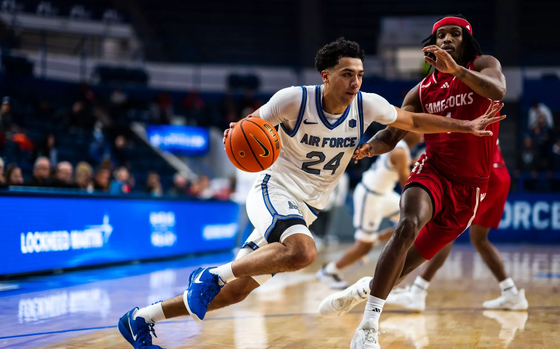 An action shot of basketball players from the Air Force Falcons and Jacksonville State facing off, Oct. 7, 2024.