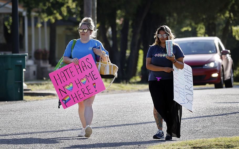 New No Hate In Texas protesters Samantha Ledbetter, left, and Crystal Ramirez arrive at at Stedfast Baptist Church to protest the New Independent Fundamentalist Baptist parishioners who gathered at their new location in Cedar Hill, Texas, July 12, 2023. 