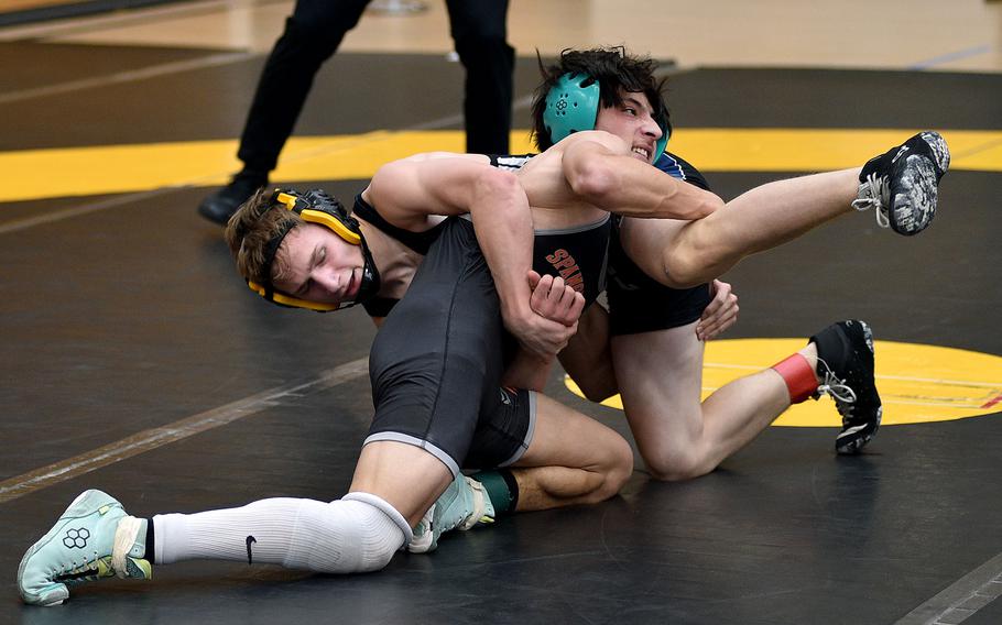 Troy Truscott and Ben Tocco grapple.