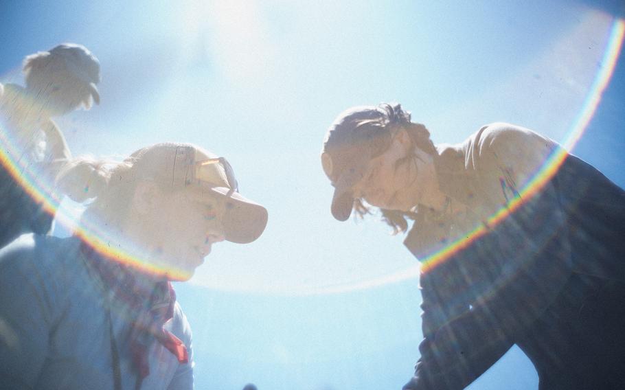 Under the sun’s glare, scientists work at Bandon Marsh.