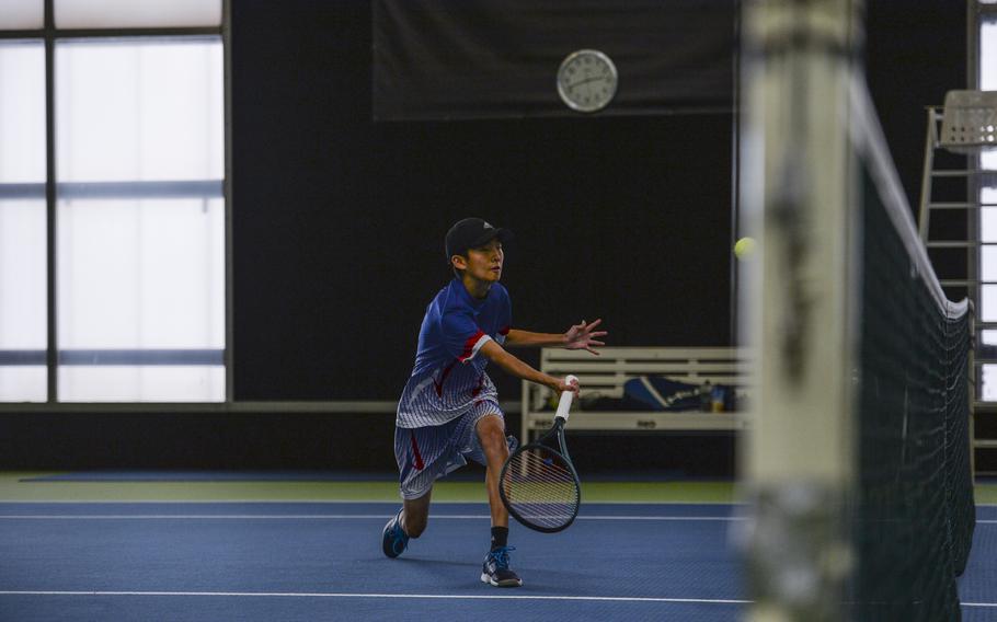 Ramstein’s Sean Kim lunges for the ball close to the net, during an intense match against Naples’ formidable duo, Kai Barania and Tavi Shah. Teaming with his brother Eric, the doubles showdown was a highlight of the DODEA European tennis championships at T2 Sports Health Club in Wiesbaden, Germany, on Oct. 21, 2023.