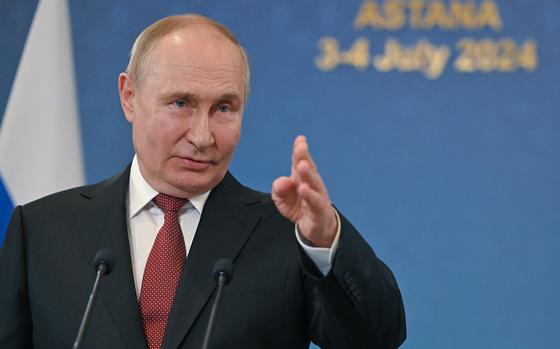 In this pool photograph distributed by the Russian state agency Sputnik, Russia's President Vladimir Putin meets with the Russian media after the Shanghai Cooperation Organisation (SCO) member states leaders' summit in Astana on July 4, 2024. (Sergei Guneyev/Pool/AFP via Getty Images/TNS)