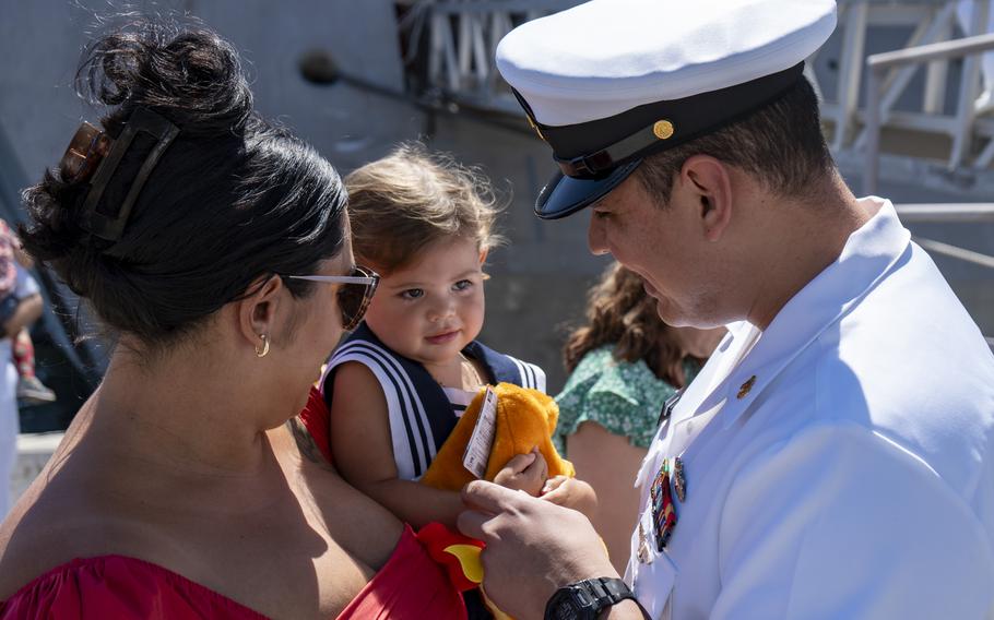 Chief Operations Specialist Miguel Murillo greets loved ones