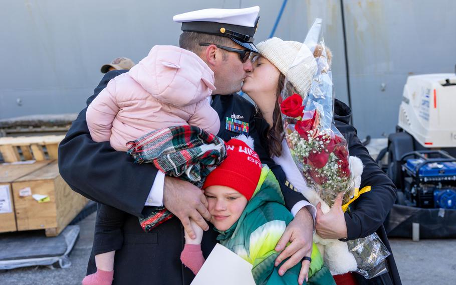 Sailor greets family