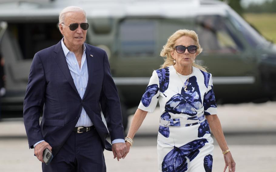 President Joe Biden, left, and first lady Jill Biden arrive on Marine One at East Hampton Airport, Saturday, June 29, 2024, in East Hampton, N.Y.