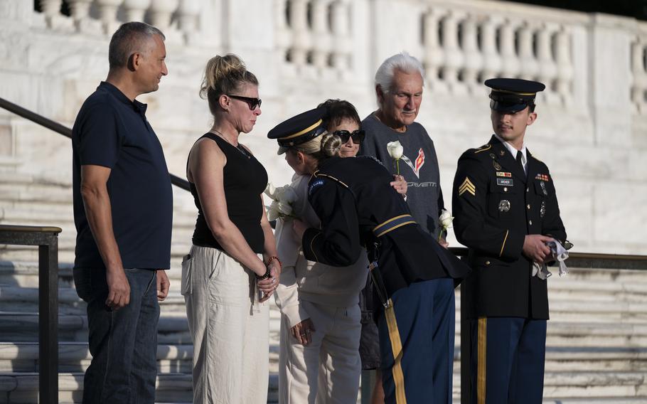 U.S. Army Spc. Jessica Kwiatkowski hugs her family after conducting her last walk ceremony at the Tomb of the Unknown Soldier, Arlington, Va., Oct. 4, 2024.