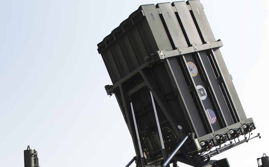 A close-up of an Iron Dome battery seen from below, pointing towards the sky.