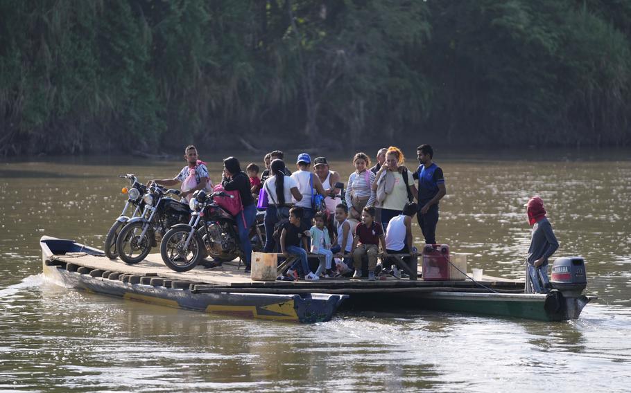 Colombians on a raft in a river.