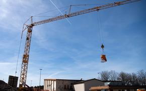 A tower crane is used at the construction site of the Military Family Housing Facility at Kapaun Air Station, Germany, April 11, 2022. The construction project is being managed by the U.S. Army Corps of Engineers, Europe District, which provides design and construction support to the U.S. Air Force in the Kaiserslautern Military Community. (U.S. Air Force photo by Airman 1st Class Alexcia Givens)