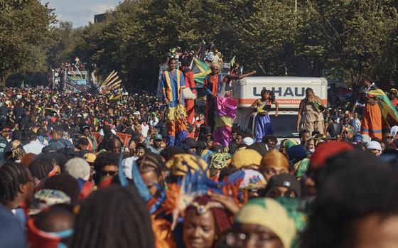 Revelers march at the intersection of Franklin Avenue and Eastern Parkway during the West Indian Day Parade on Monday, Sept. 2, 2024, in the Brooklyn borough of New York. (AP Photo/Andres Kudacki)