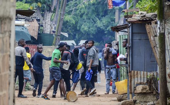 Protesters recover from tear gas fired by police in Maputo, Mozambique, Thursday, Nov. 7, 2024. Protesters dispute the outcome of the Oct. 9 elections, which saw the ruling Frelimo party extend its 49-year rule. (AP Photo/Carlos Uqueio)