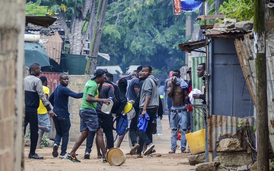 Protesters recover from tear gas fired by police