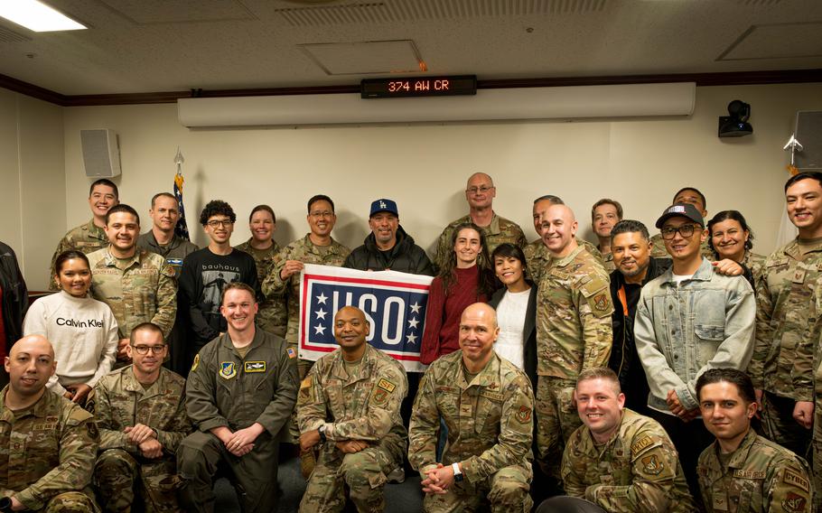 Jo Koy poses for a group photo with Yokota Air Base leadership, friends, and family