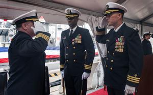 Cmdr. Michael Gunther, right, salutes Capt. Cary Krause, left, during a change of command ceremony aboard the guided-missile destroyer USS McFaul (DDG 74). Gunther relieved Brown as commanding officer. (U.S. Navy photo by Mass Communication Specialist Seaman Ryan U. Kledzik/Released)