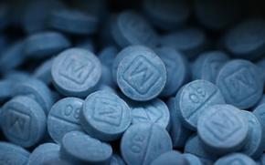 Hundreds of seized fentanyl pills that imitate Oxycodone M30 are kept as evidence at the Drug Enforcement Administration's Dallas Field Division lab, Aug. 1, 2023. (Tom Fox/Dallas Morning News/TNS)