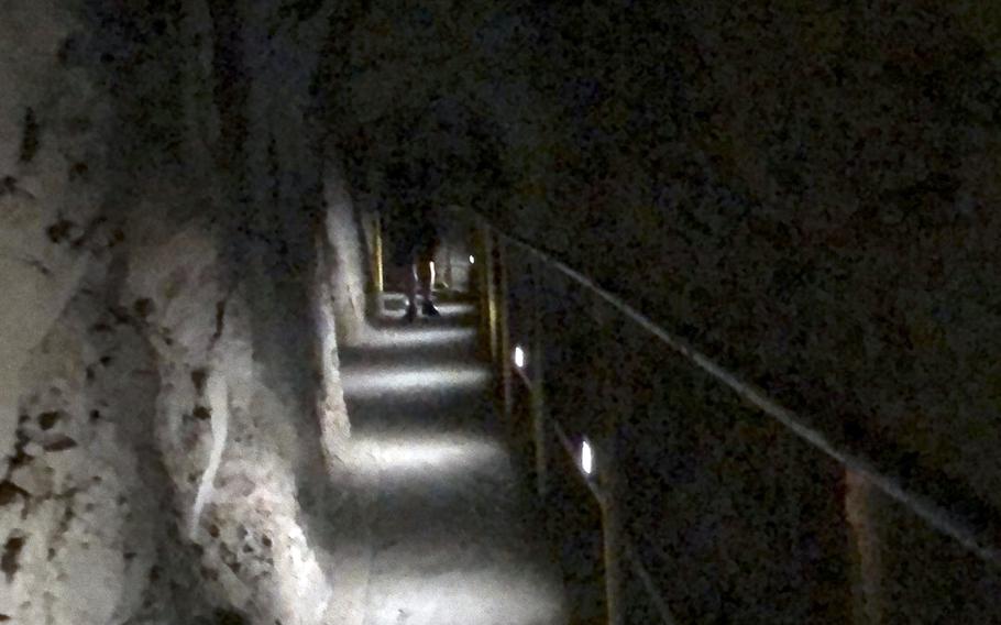 Part of the hike to the summit of Diamond Head State Monument involves a walk through a dimly lit tunnel.