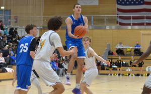 Marymount's Patrick Gianni eyes the basket as he scores in the boys Division II final at the DODEA-Europe basketball championships in Wiesbaden, Germany, Feb. 15, 2025. The Cougars beat the Royals 57-39 to take th division title.