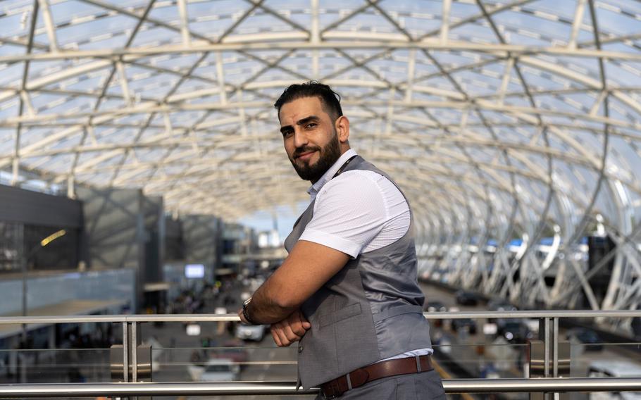 Mirwais Jalali, a recruiter for aviation contractor Unifi, poses for a portrait at Hartsfield-Jackson airport in Atlanta on Friday, April 19, 2024.