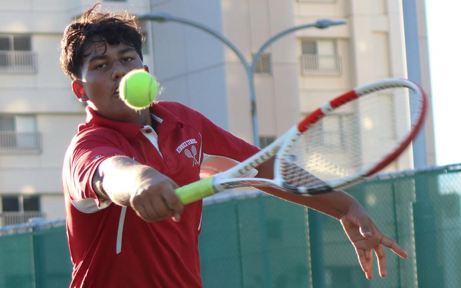 Nile C. Kinnick’s Tavi Shah delivers a backhand during Wednesday’s Kanto Plain tennis matches. Shah and partner Noah Otteson lost to Masato Fuchinoue and Kakeru Adachi  of St. Mary’s 8-3.