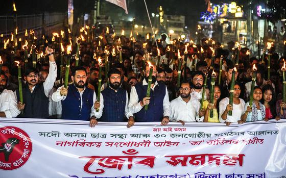 All Assam Students Union (AASU) members take out a torch procession to ...