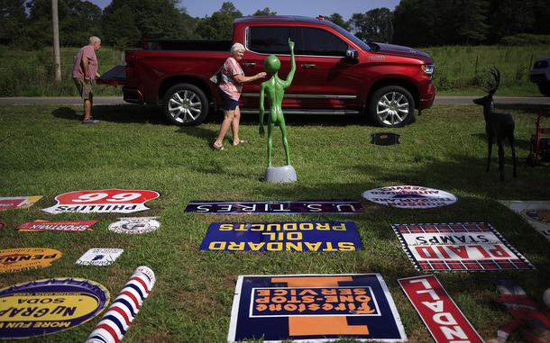 Antique signs are displayed for sale during the U.S. 127 Yard Sale on Aug. 1 in Collinsville, Ala. 