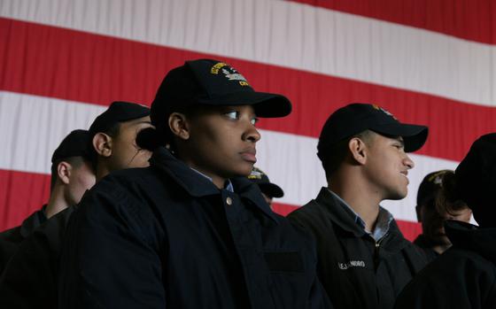 Norfolk, Virginia, Jan. 9, 2009: BMSN Riscinda Rogers, Chicago, Il., left, and the crew of the Nimitz-class aircraft carrier USS George H.W. Bush receive instructions to prepare the ship for the arrival of President George W. Bush for the next day’s commissioning ceremony.

META TAGS: U.S. Navy; CVN 77; USS George H.W. Bush; Nimitz-class; Naval Air Force Atlantic; AIRLANT