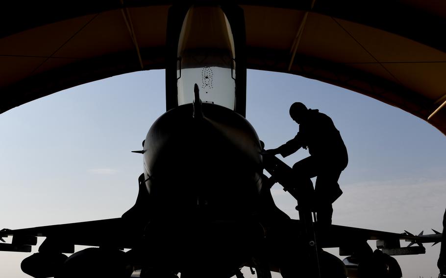 A New Jersey Air National Guard airman climbs down from his aircraft after arriving within U.S. Central Command’s area of responsibility.