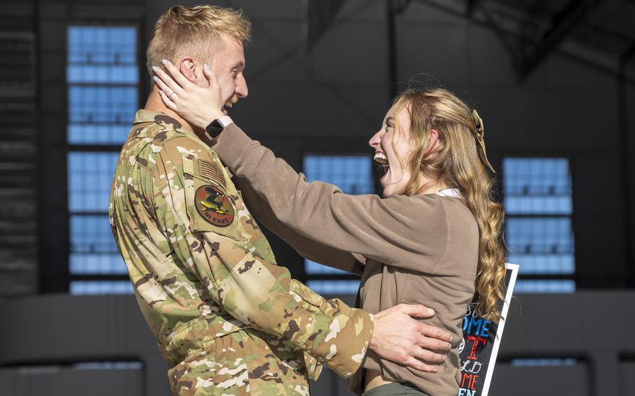 Airman embraces a loved one