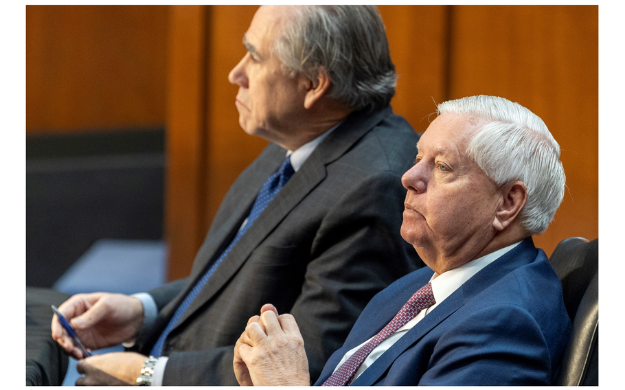 Graham and Merkley sit and listen during a budget hearing.