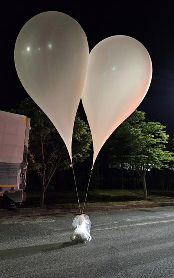 North Korean balloons with bags tethered to them are seen in this undated photo taken in South Chungcheong province, South Korea.