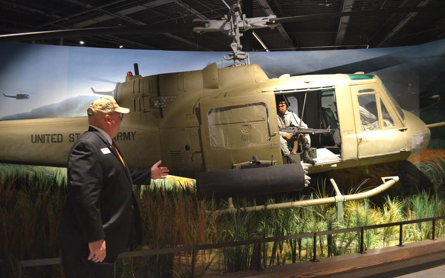 Retired Lt. Col. Bob Crouch discusses a UH-1 “Huey” helicopter on display at the National Mounted Warrior Museum at Fort Cavazos, Texas.