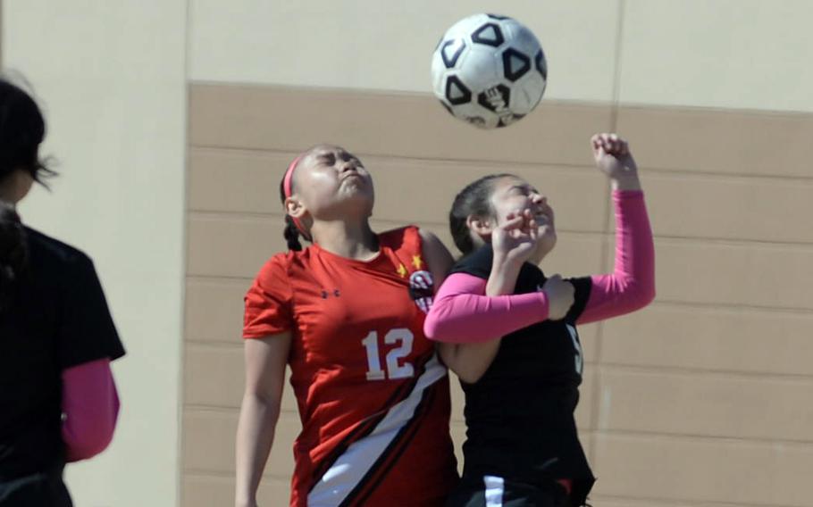 Ella Cala and Priscilla Ramirez battle for the ball.