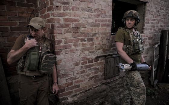 Ukrainian soldiers prepare to fire 120mm mortar toward Russian position on the front line at undisclosed location in Donetsk region, Ukraine, June 4, 2024.