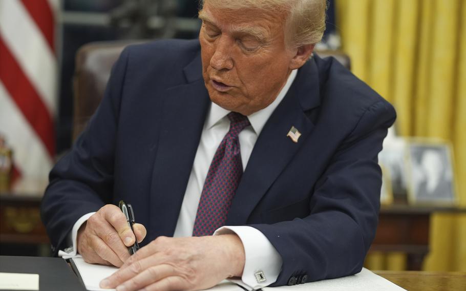 President Donald Trump signs an executive order on birthright citizenship in the Oval Office of the White House.