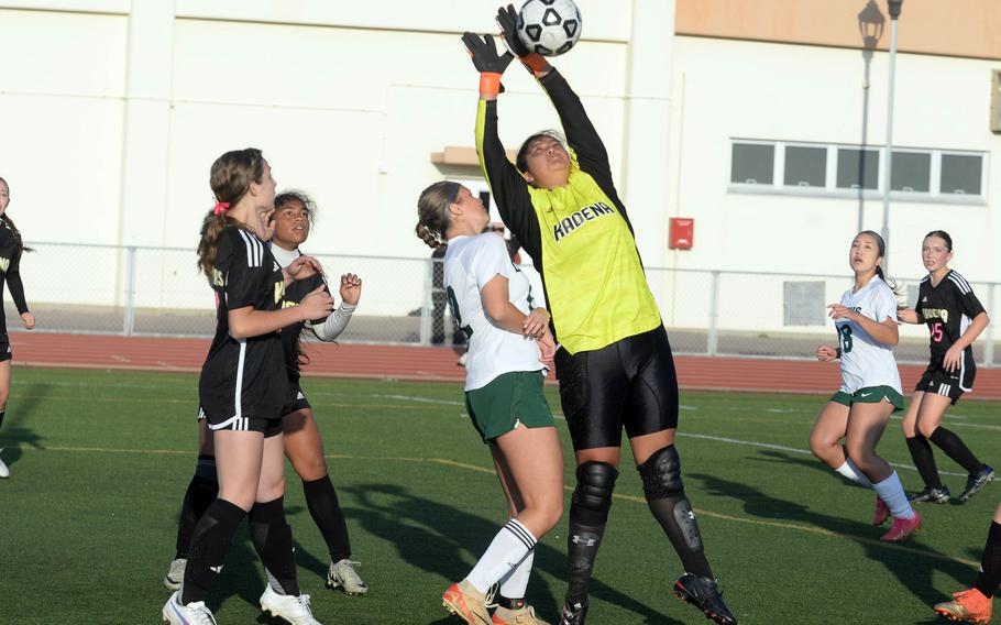 Suni Mauricio tries to snatch the ball.