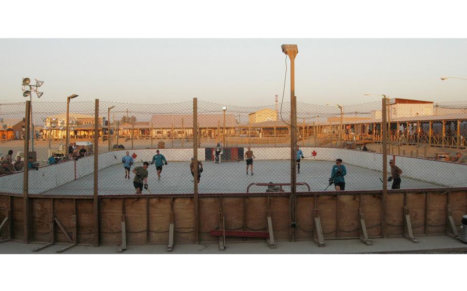 Players scrimmage in preparation for the upcoming season of the Kandahar Hockey League at Kandahar Airfield in southern Afghanistan. Last season, there were 24 teams in the ball hockey league — 21 made up of Canadians, two from Slovakia and one from the United States.