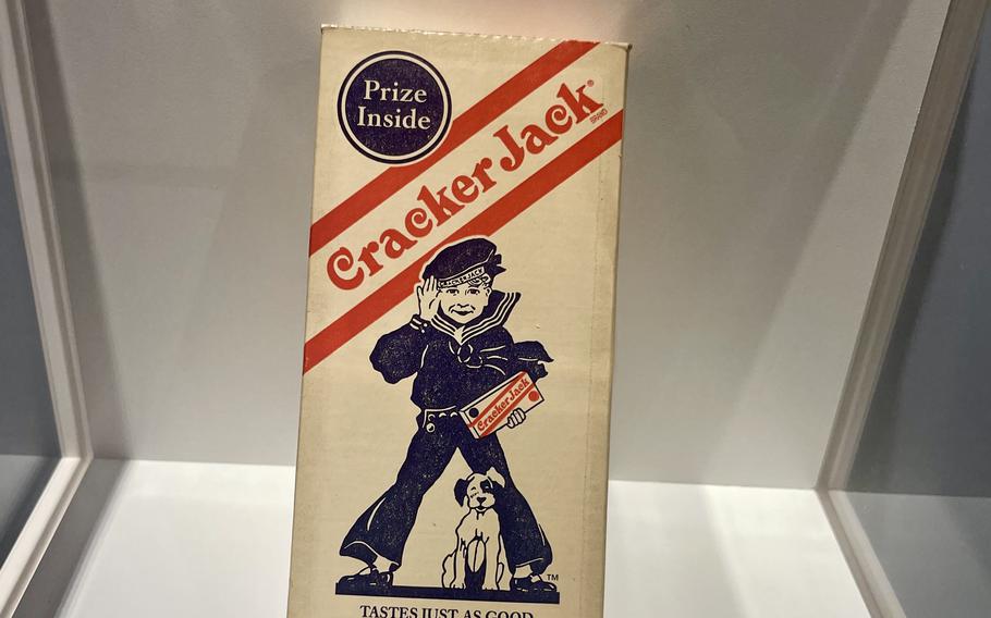 An exhibit at the Navy Museum shows an early version of a Crackerjack box, which contains an illustration of a Navy sailor.