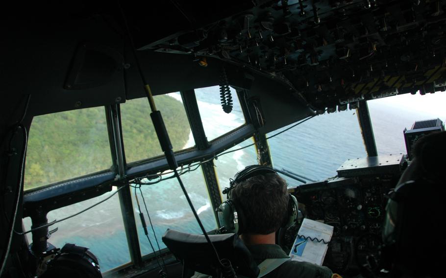 A C-130 banks left toward the Micronesian island of Ulul 