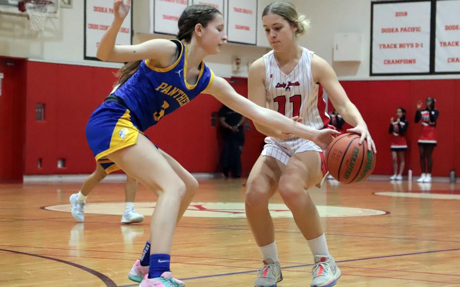 Molly Bogdan tries to take the ball from Sydnee Walker.