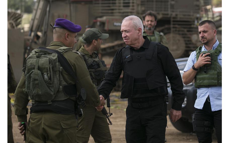 Israeli Defense Minister Yoav Gallant meets soldiers on the Israeli border with the Gaza Strip on Oct. 19, 2023, in Sderot, Israel. 