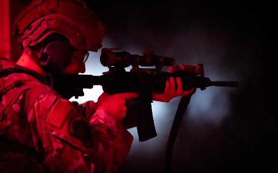 An Airman assigned to the 153d Airlift Wing Security Forces Squadron aims an MF Carbine assault rifle during night-firing training at F.E. Warren Air Force Base in Cheyenne, Wyo, on May 18, 2024. During this training, Airmen familiarized themselves with their night-vision gear and trained with red tracers. (U.S. Air National Guard photo by Staff Sgt. Kylee Warren)