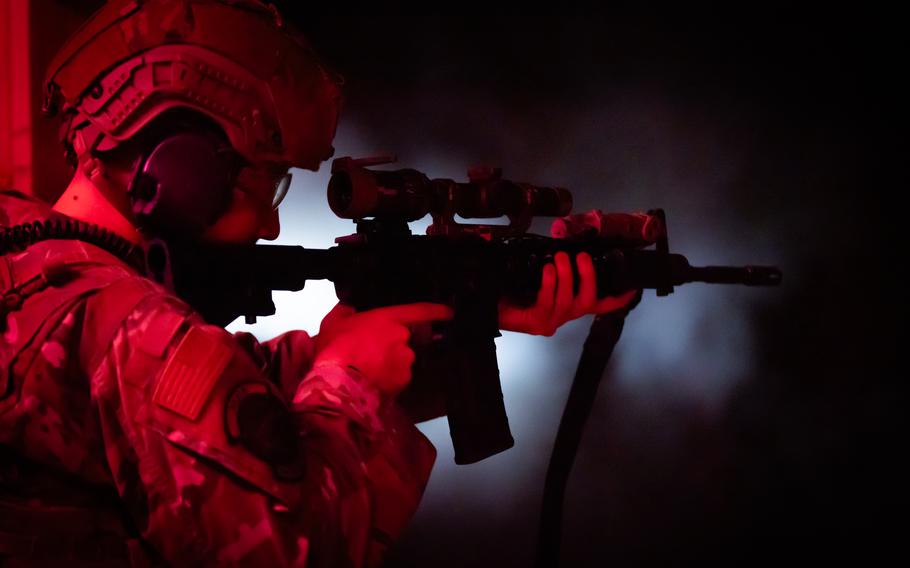 An Airman assigned to the 153d Airlift Wing Security Forces Squadron aims an MF Carbine assault rifle during night-firing training at F.E. Warren Air Force Base in Cheyenne, Wyo, on May 18, 2024.