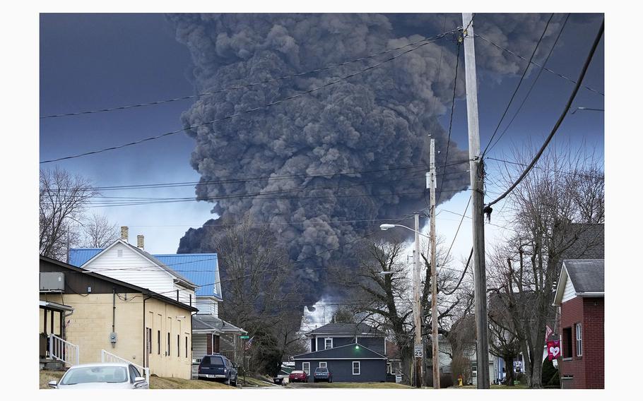 A black plume rises over East Palestine, Ohio, as a result of a controlled detonation of a portion of the derailed Norfolk Southern trains, Feb. 6, 2023. 