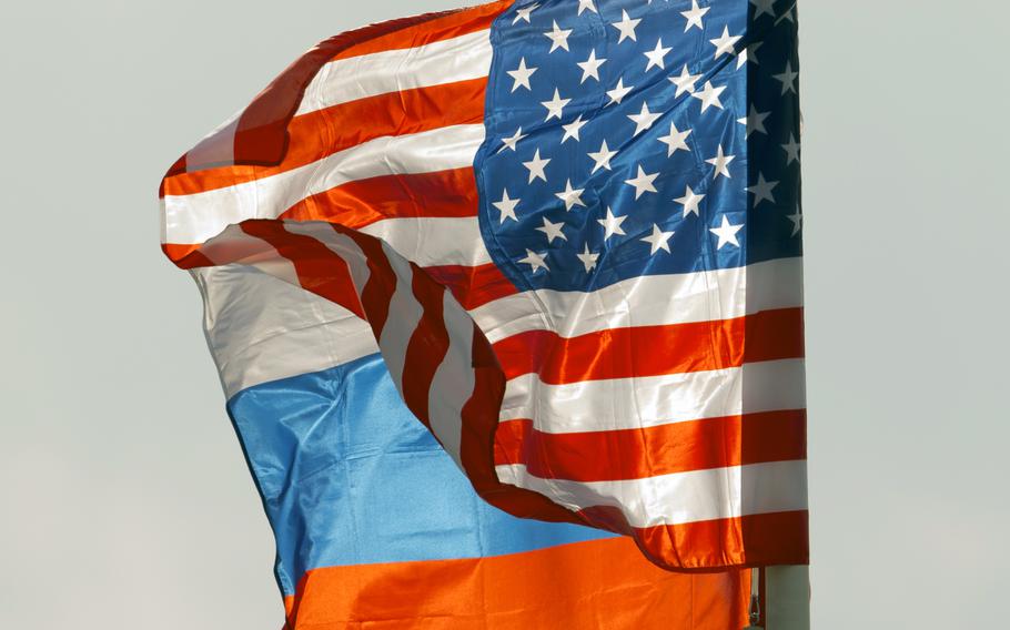 The U.S. national flag flies beside the Russian national flag.