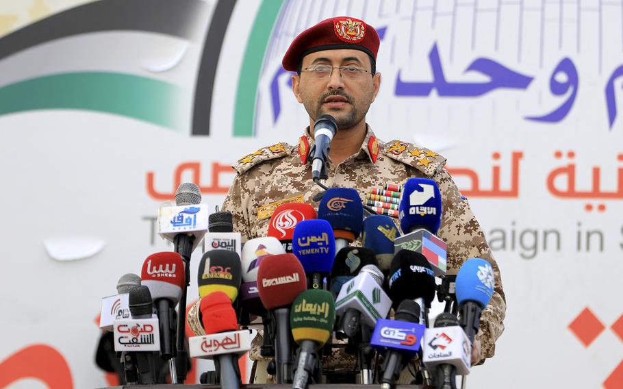 Houthi military spokesman, Brigadier Yahya Saree, delivers a statement on the recent attacks against two commercial vessels in the Red Sea during a march in solidarity with the people of Gaza in the capital Sanaa on Dec. 15, 2023. Yemen’s Houthi rebels struck a cargo ship in the Red Sea on Dec. 15, causing a fire on deck in the latest of a near-daily series of attacks in the commercially vital waterway.