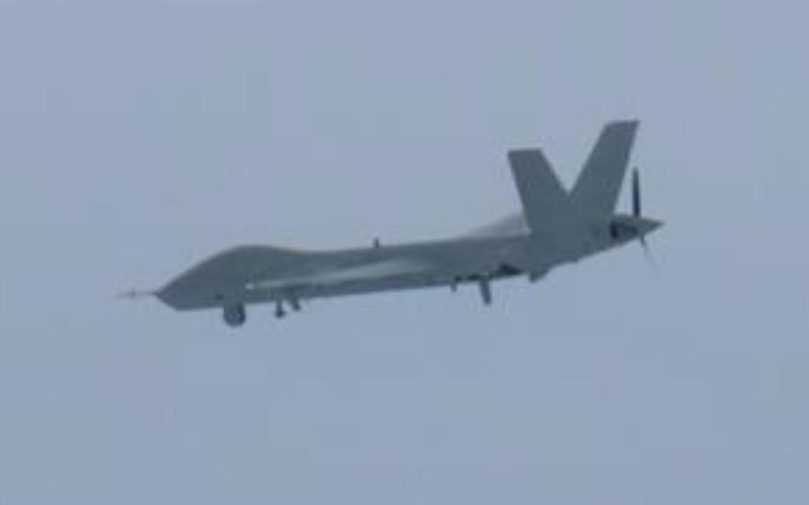 A video still of a military drone operating in open airspace.